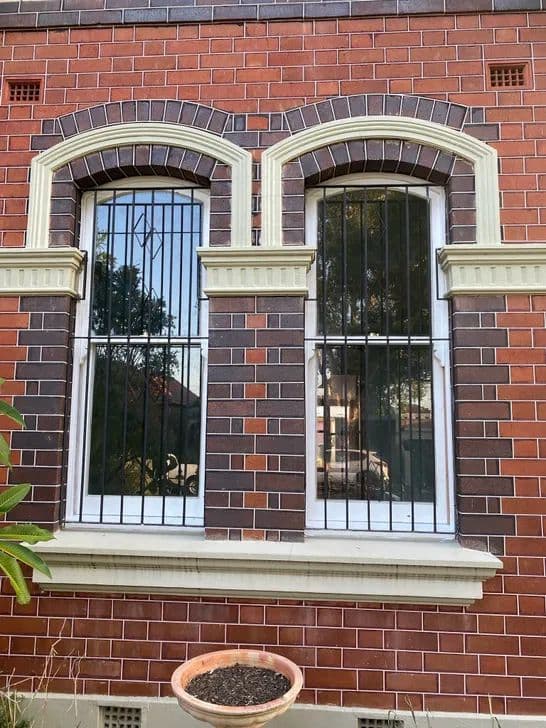 Traditional double-hung sash windows being repaired in a Sydney heritage interior