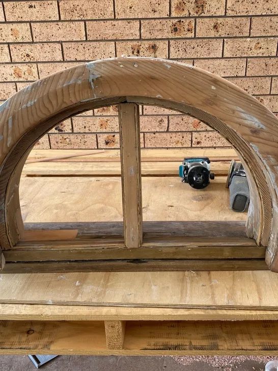 Bespoke arched window frame in the workshop
